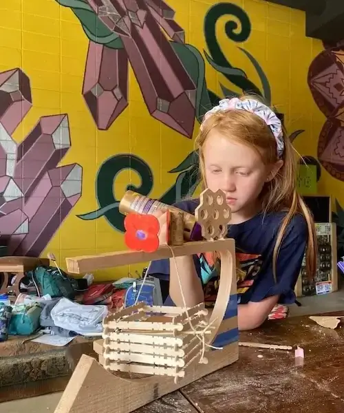 Girl working on a wood project