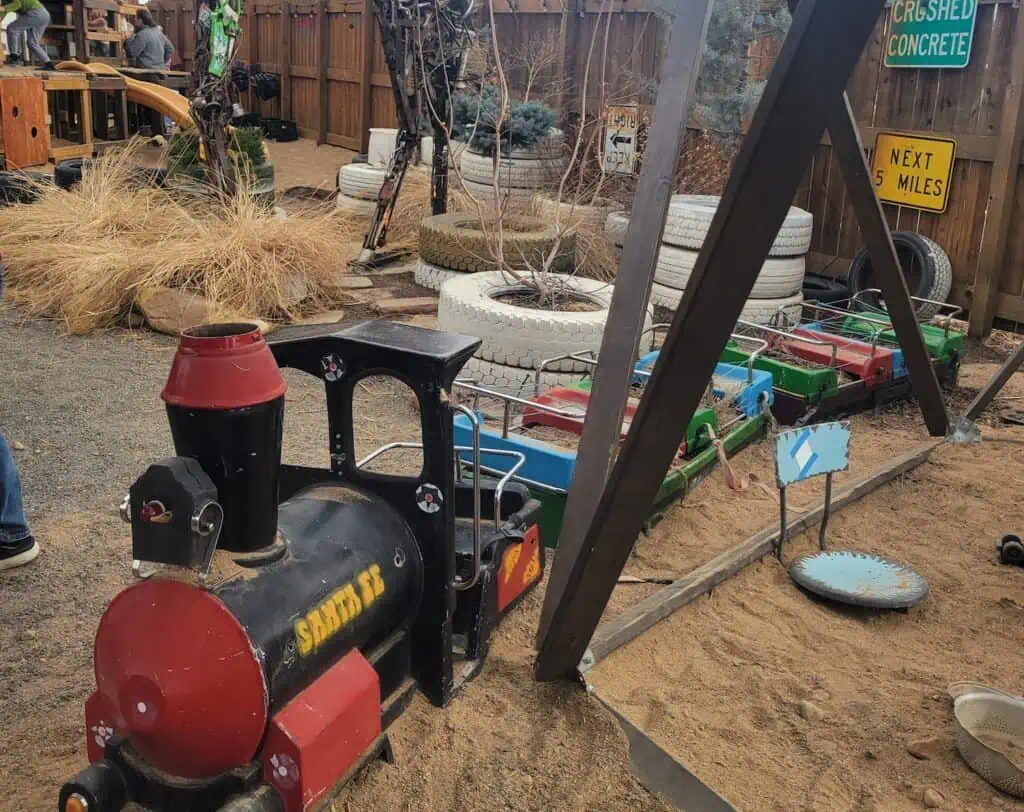 Junkyard's Outdoor play area with a small train engine